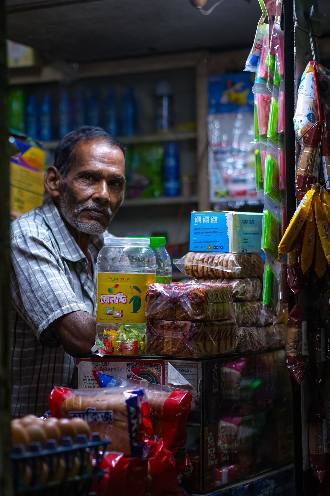 A shopkeeper at a grocery store