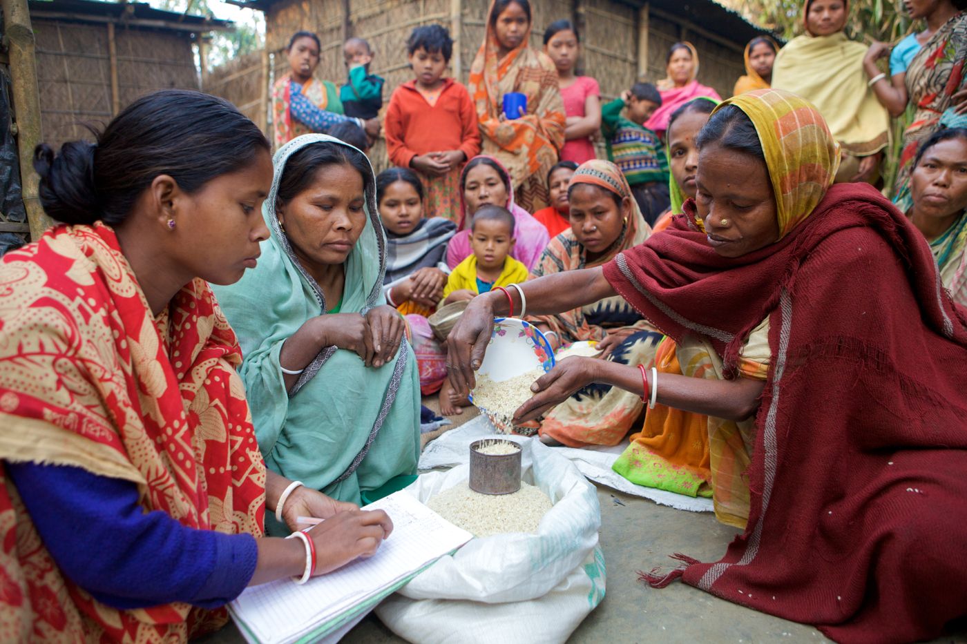 Women organising community resources together in Bangladesh