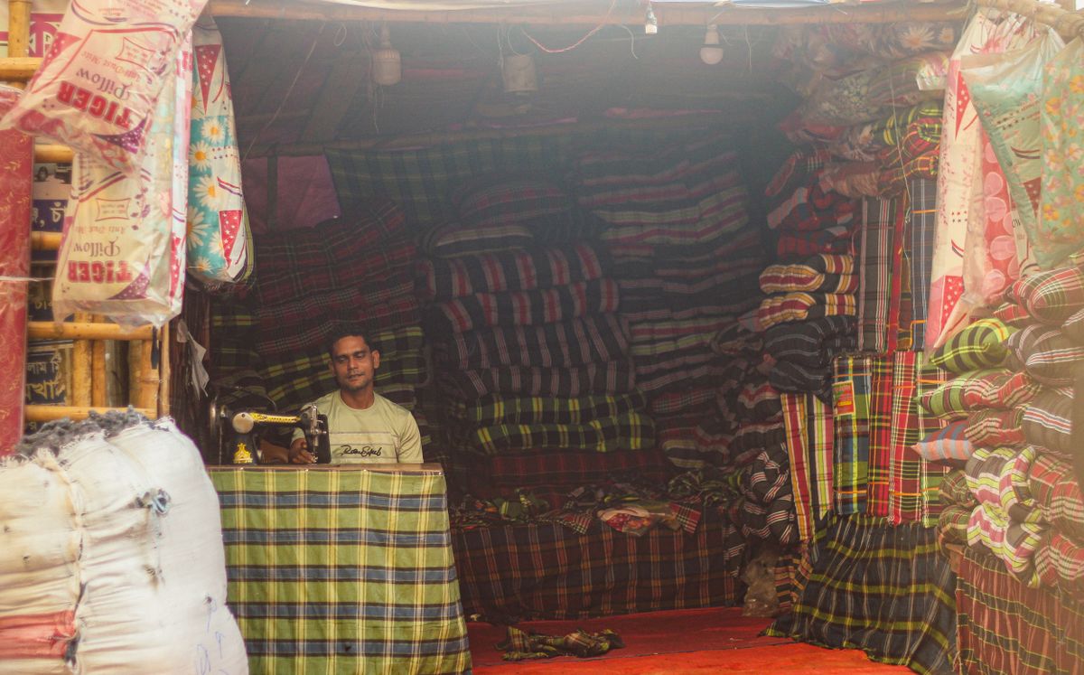 A textile vendor at work in Dhaka